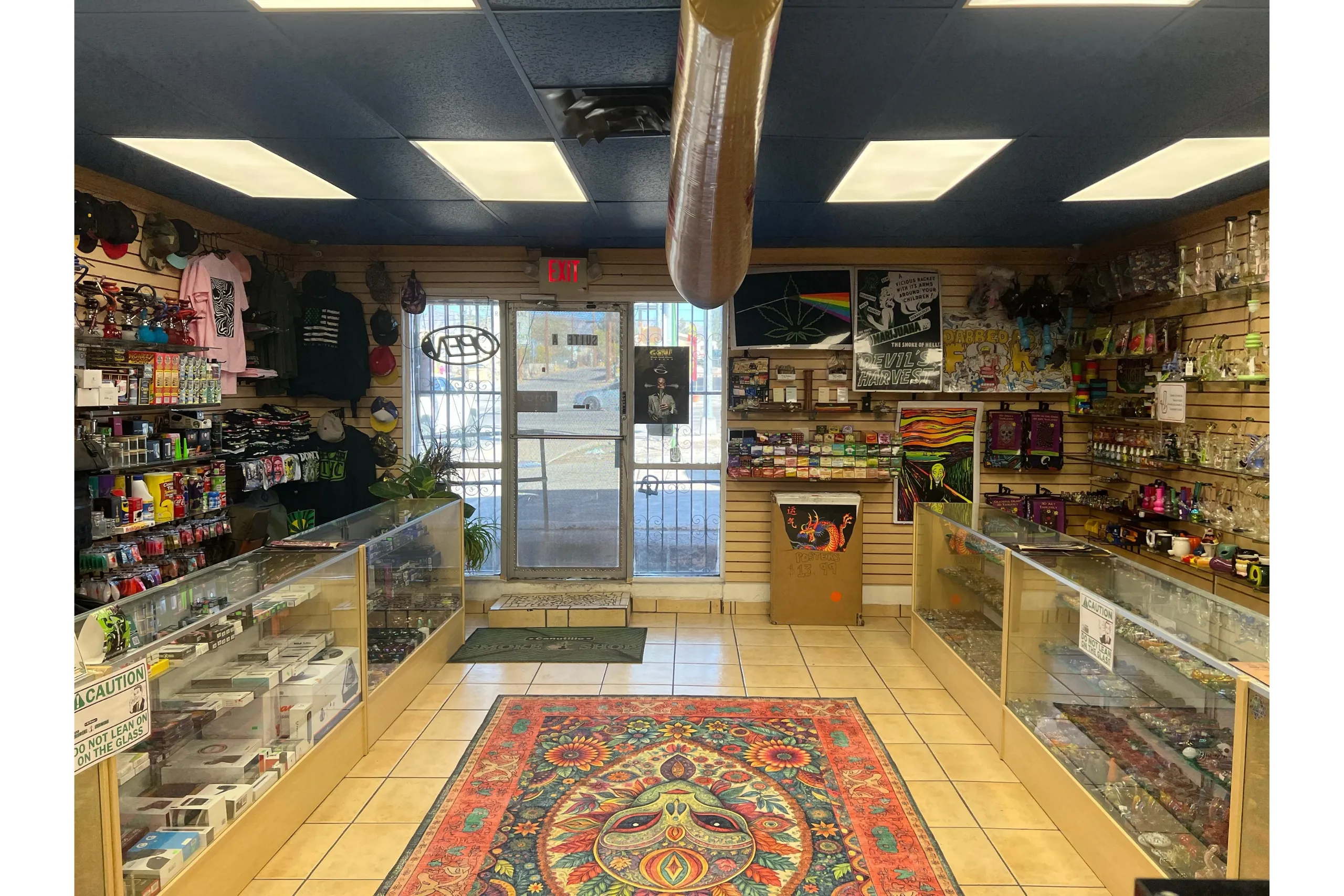 Opposite wide view of Canutillo Smoke Shop showcasing additional product displays and store layout.