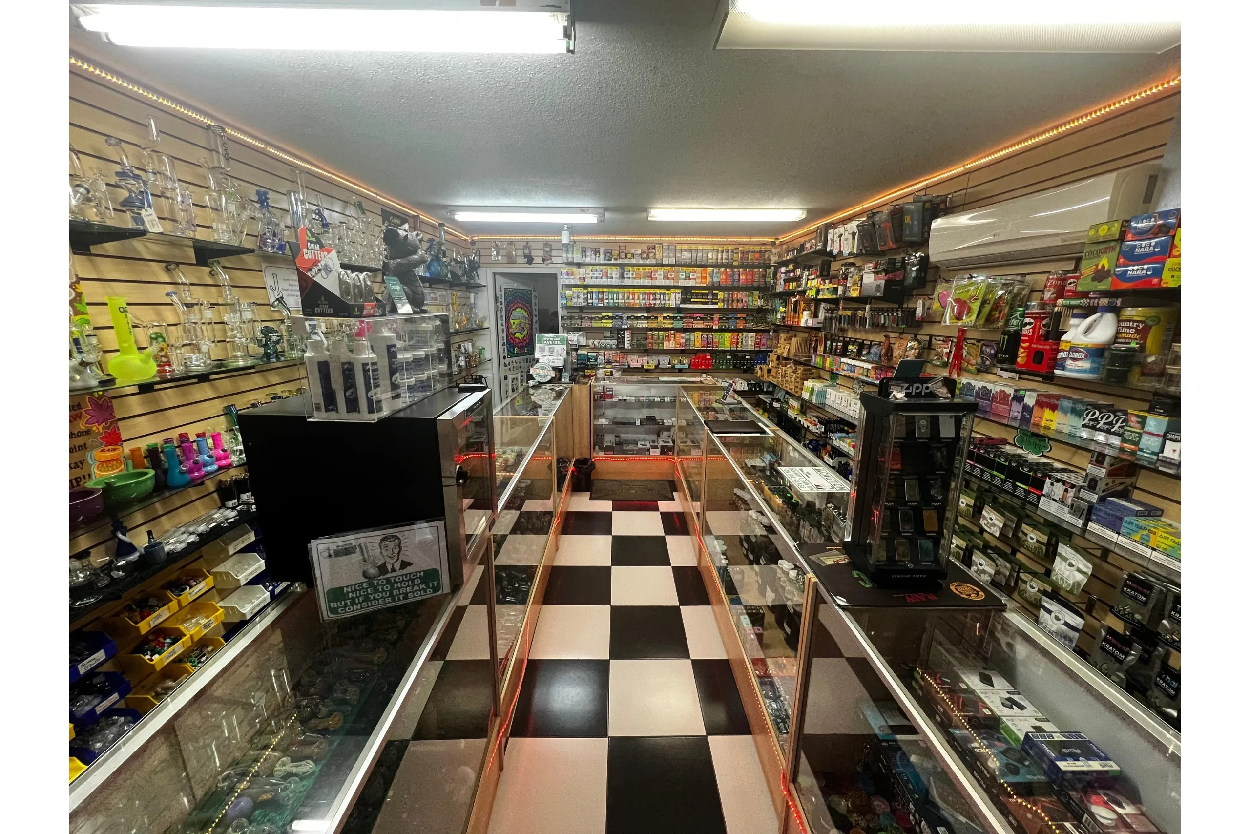 Interior view of Doniphan Smoke Shop showcasing a spacious layout with premium smoking tools, vape devices, and glassware.