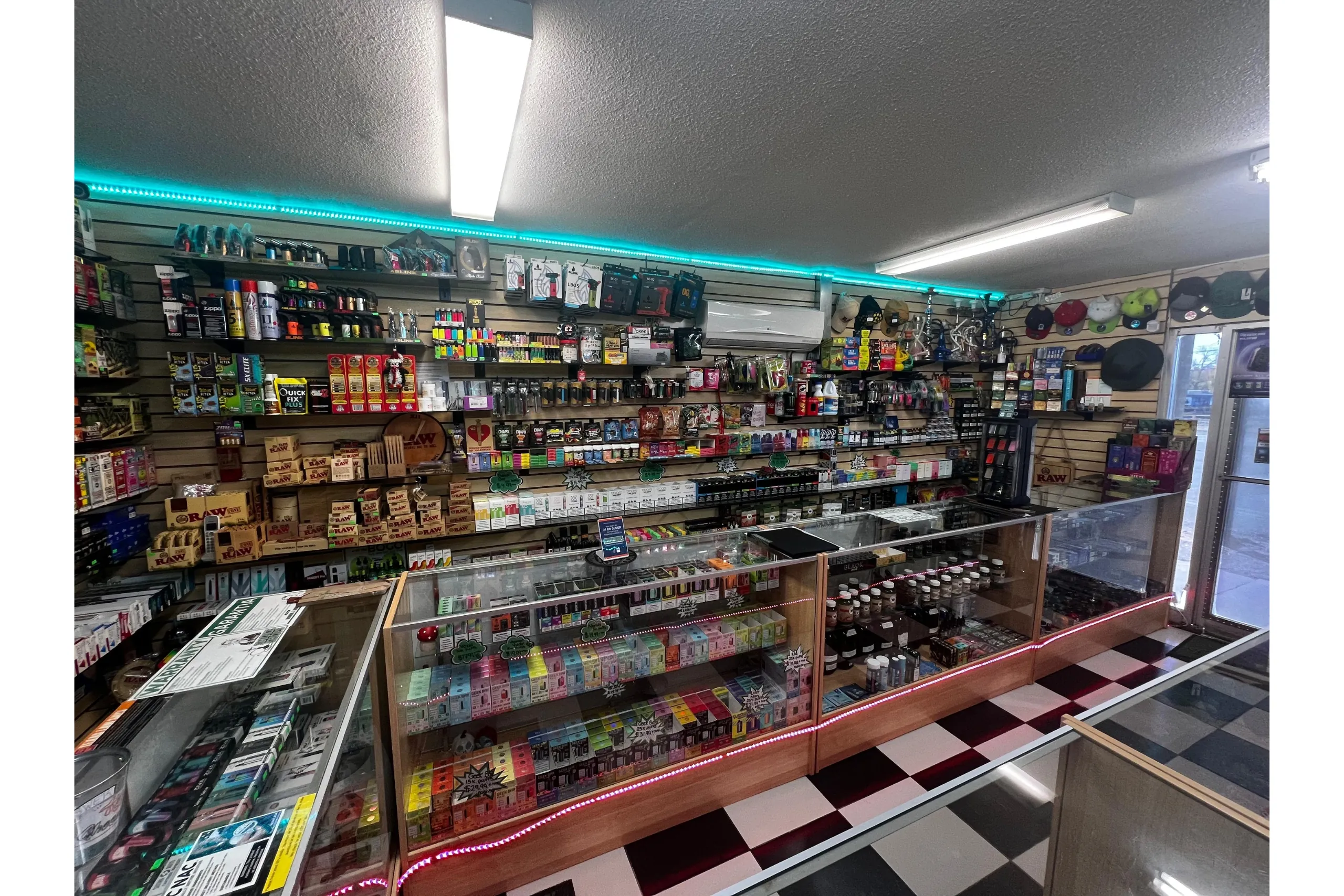 Display of vape products, herbal kratom, RAW rolling papers, and detox supplies at Doniphan Smoke Shop.