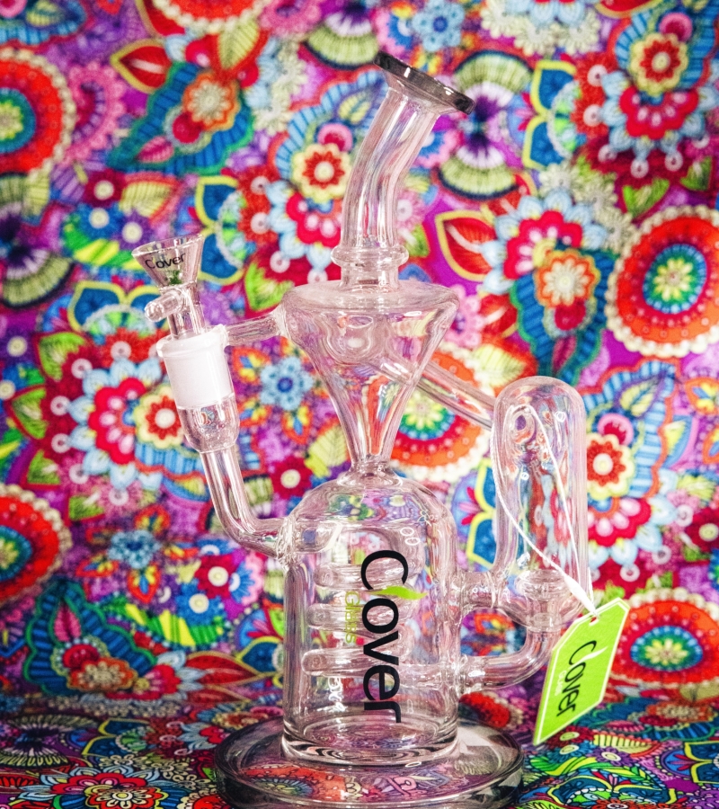 A picture of a Clover Water Pipe with a groovy pink 70s esqu background